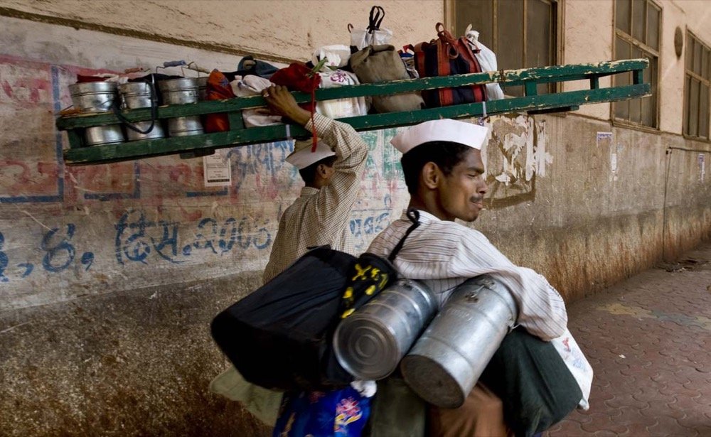 Figure 2: Mumbai's dabbawala (tiffin) service, the book's own named example of a personal service, delivers home-cooked lunches to about 1,75,000 customers across the city. Photo: Steve Evans / Wikimedia Commons / CC BY 2.0.